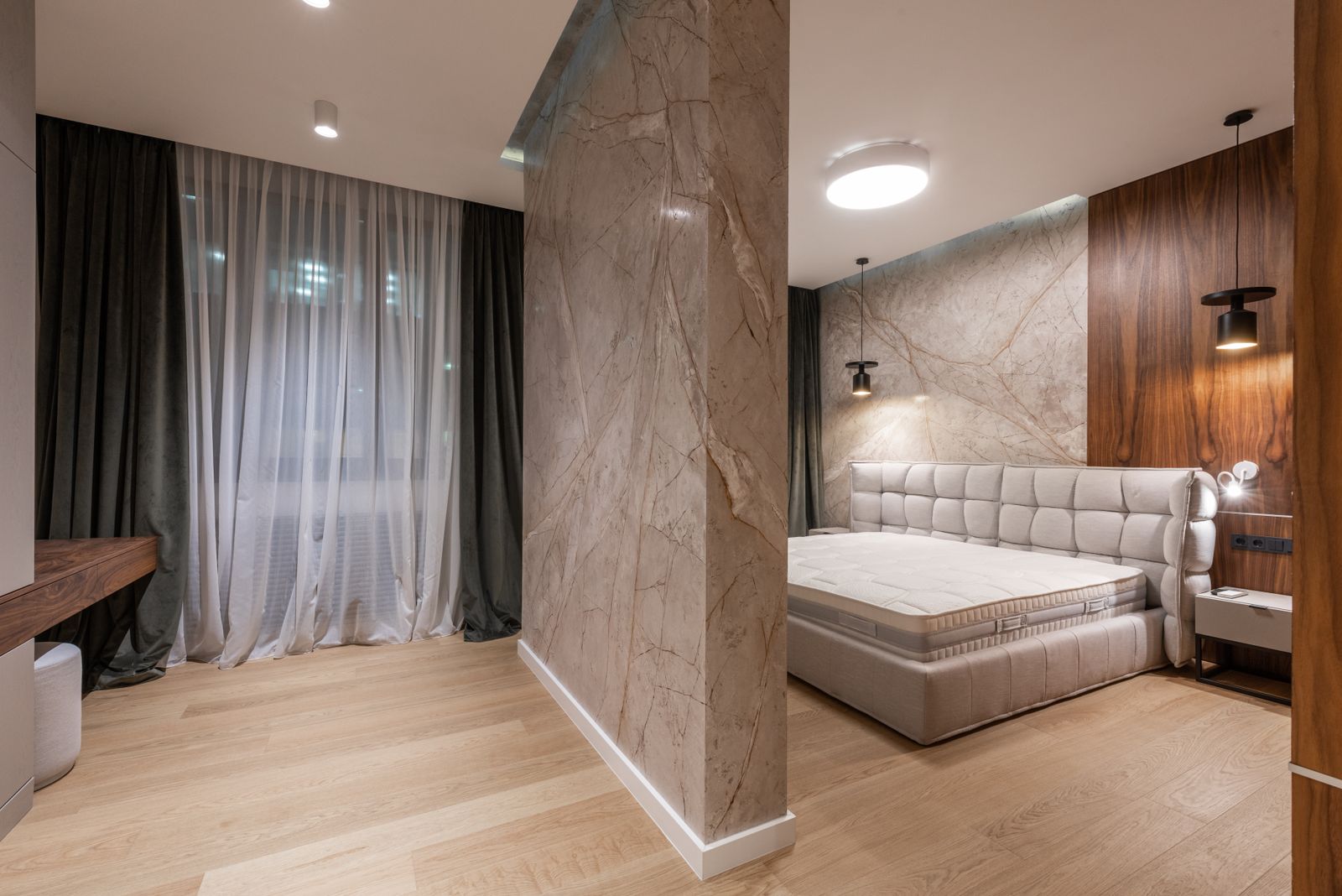 A calm, clean bedroom with the bed made